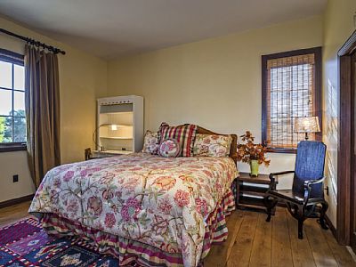 Guest Bedroom 1 features a king sized bed and an en suite bathroom.